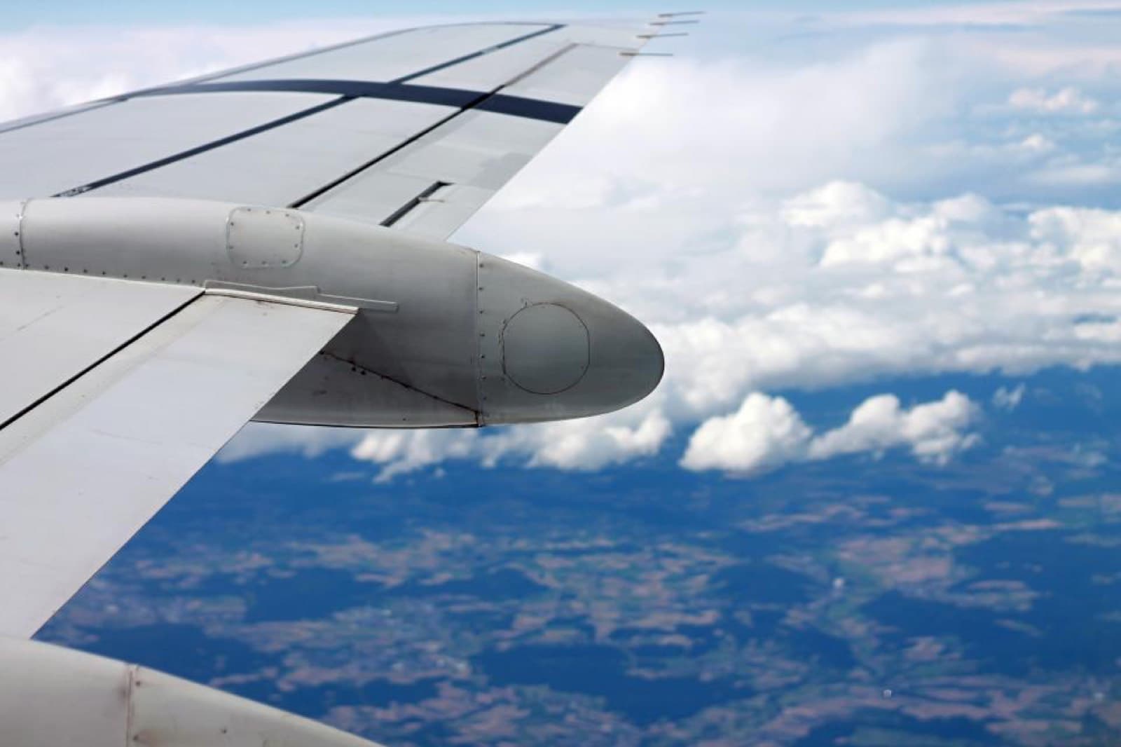 A wing above the clouds